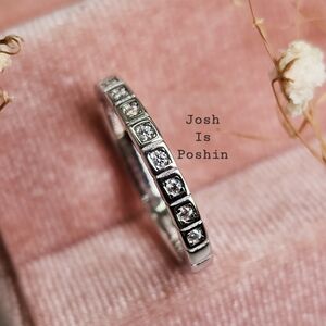 0.15CTW. Moissanite half eternity band in sterling silver